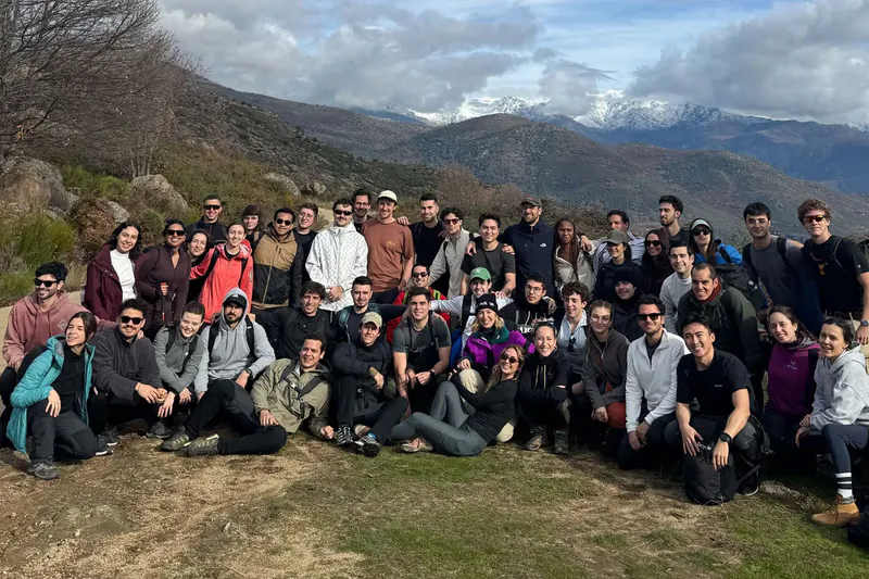 Team group photo in the mountains with snowy peaks
