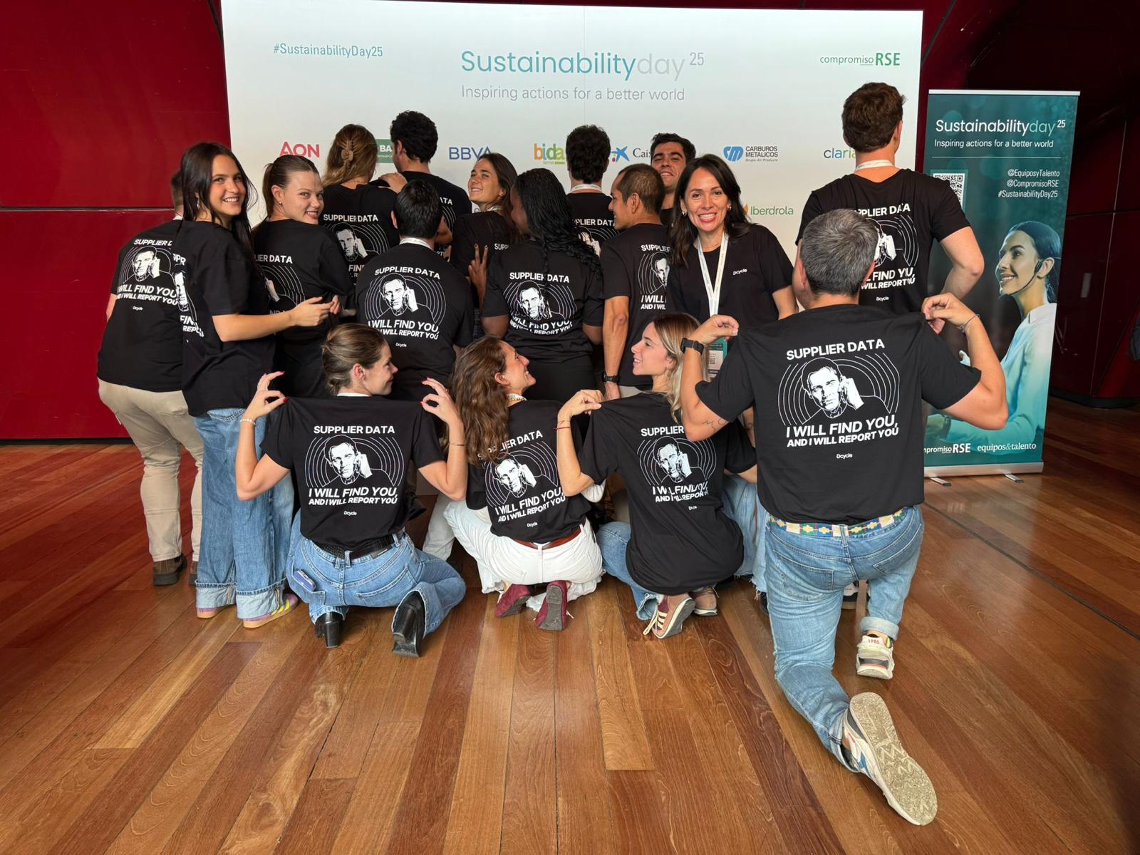 Dcycle team showing Supplier Data I Will Find You shirts at Sustainability Day 2025